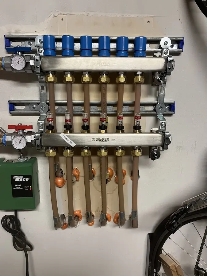 Plumber performing Water Heater Repair at a residential property in Alvin